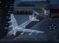 Aerial view showing Christmas lights covering the wings and fuselage of a B-52 bomber